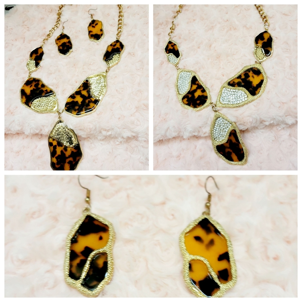 A stunning and eye-catching gold leopard necklace and earring set, complemented